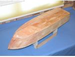 Photo 12: The hull is now completely planked and fibreglass resin coated.
