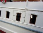 A false window is actually painted on a side cargo hatch and please note the ornamental rigols above the windows, each individually cast using filler from a master.