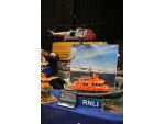 An imaginative diorama using lifeboat and helicopter models.